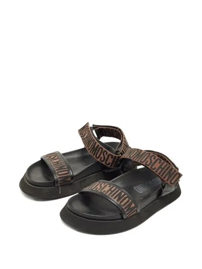 Pre-owned Moschino Logo-embellishment Sandals In Black