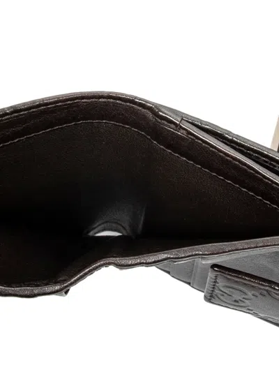 Pre-owned Gucci Embossed Flap Wallet In Brown