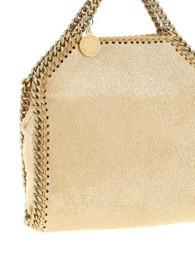 Stella Mccartney Falabella Tiny Crossbody Bags Gold In Nude