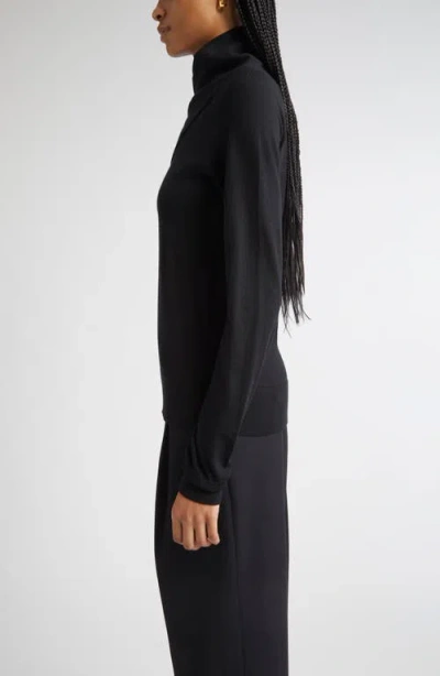 Totême Toteme Merino Wool Crossover Sweater In Black