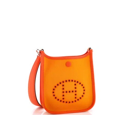 Pre-owned Hermes  Hermes Neo Evelyne Bag Toile And Leather Tpm In Orange