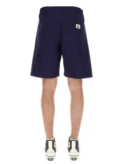 Umbro Logo Patch Bermuda Shorts In Blue