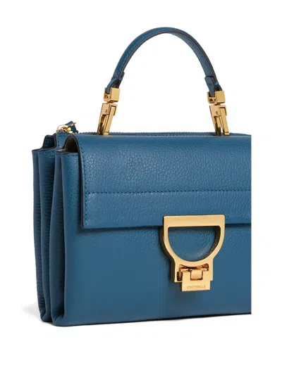Coccinelle Small Arlettis Cross Body Bag In Blue