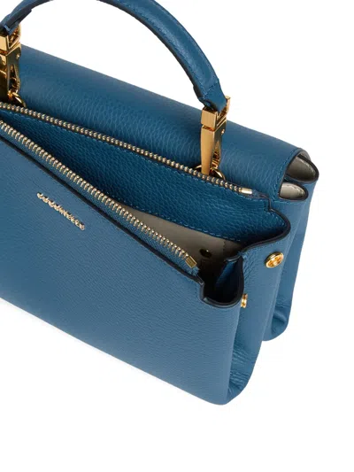 Coccinelle Small Arlettis Cross Body Bag In Blue