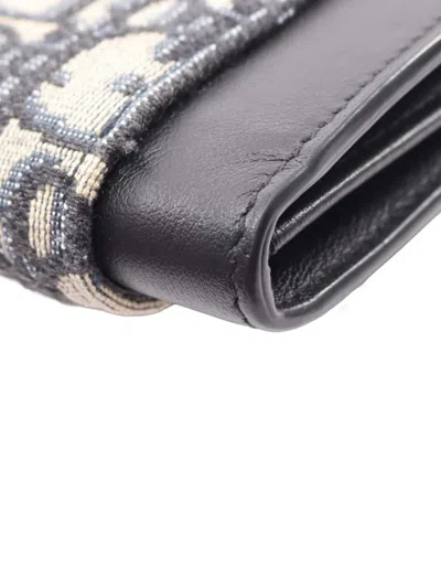 Pre-owned Dior 2010-2025 Oblique Canvas And Leather Elite Saddle Crossbody Bag In Brown