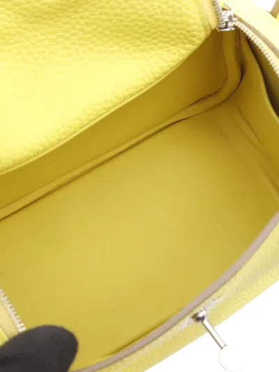 Pre-owned Hermes 2022 Mini Taurillon Clemence Lindy Satchel In Yellow