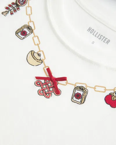 Hollister Good Luck Charm Graphic Baby Tee In White