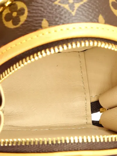 Pre-owned Louis Vuitton Boite Chapeau Necklace Bag Monogram Canvas Crossbody Bag In Brown