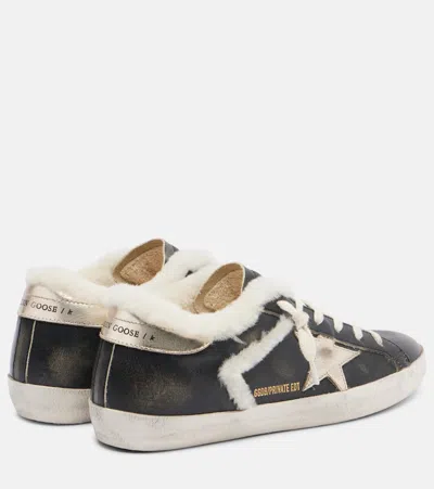 Golden Goose Super-star Shearling-trimmed Leather Sneakers In Black