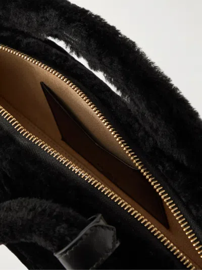 Alaïa Le Teckel Leather-trimmed Shearling Clutch In Black