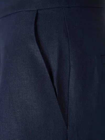 Andres Otalora Pleated Flared Trousers In Blue