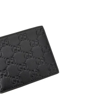 Gucci Men Gg Emblem Leather Wallet With Embossed Gg Logo In Black