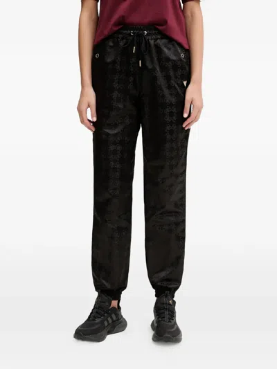 Guess Usa Aop Drawstring Monogram Trousers In Black