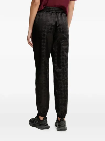 Guess Usa Aop Drawstring Monogram Trousers In Black