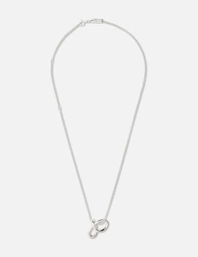 Avgvst Small Mathematical Knot On A Chain In Metallic