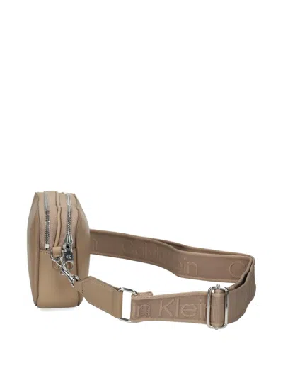 Calvin Klein Embossed Logo Crossbody Bag In Brown