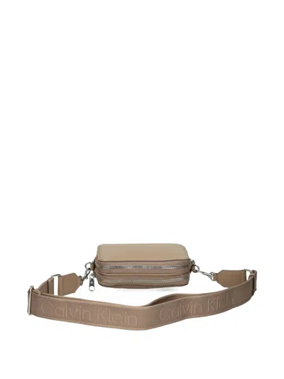 Calvin Klein Embossed Logo Crossbody Bag In Brown