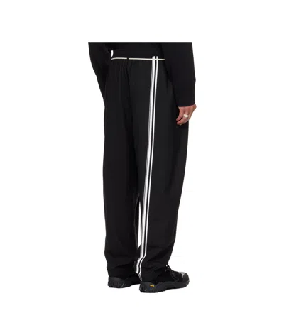 Mordecai Tapered Black Trousers With Pleated Front In Black