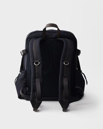 Prada Triangle-logo Zipped Backpack In Blue