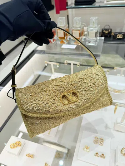 Valentino Garavani Mini Structured Handbag With Signature Detailing In Gold