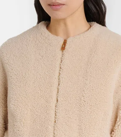 Alaïa Peplum Shearling Jacket In Brown