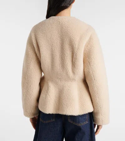 Alaïa Peplum Shearling Jacket In Brown