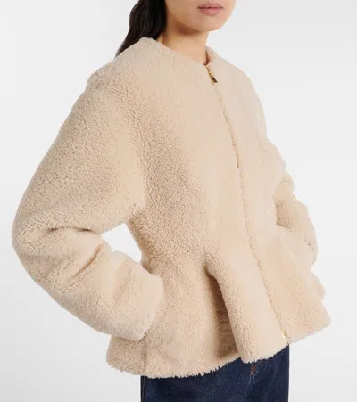 Alaïa Peplum Shearling Jacket In Brown