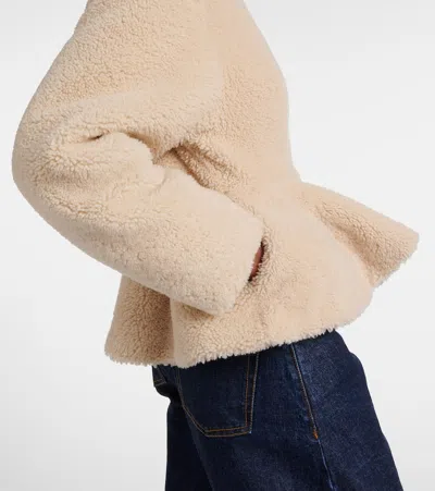 Alaïa Peplum Shearling Jacket In Brown