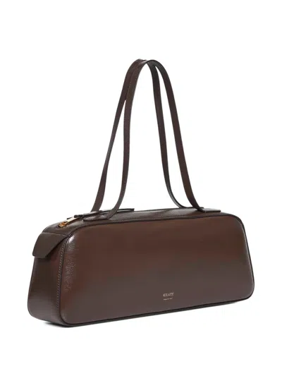 Khaite Simona Crackle Patent Elongated Tote Bag In Brown