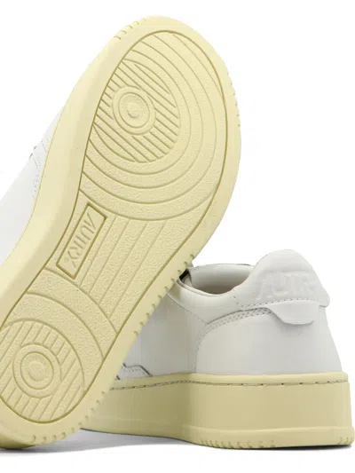 Autry Low-top Sneakers With Contrast Sole And Perforated Detailing In White
