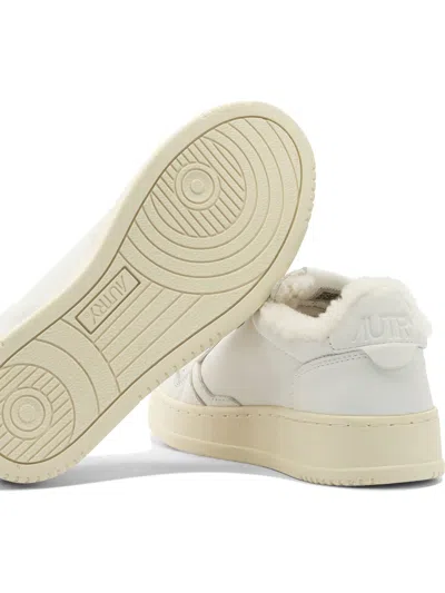 Autry Low-top Sneakers With Contrast Sole And Perforated Detailing In White