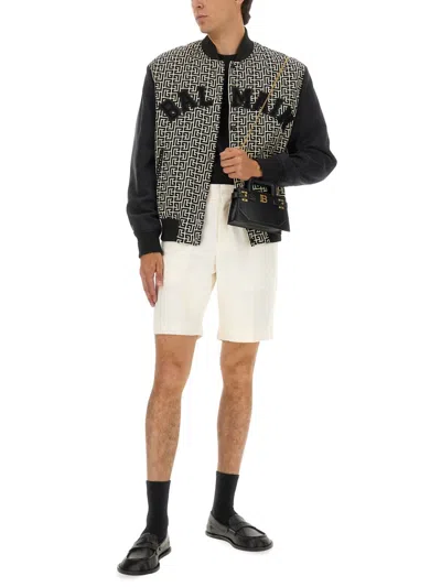 Balmain Monogrammed Varsity Jacket With Patches In Black