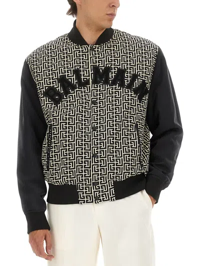 Balmain Monogrammed Varsity Jacket With Patches In Black