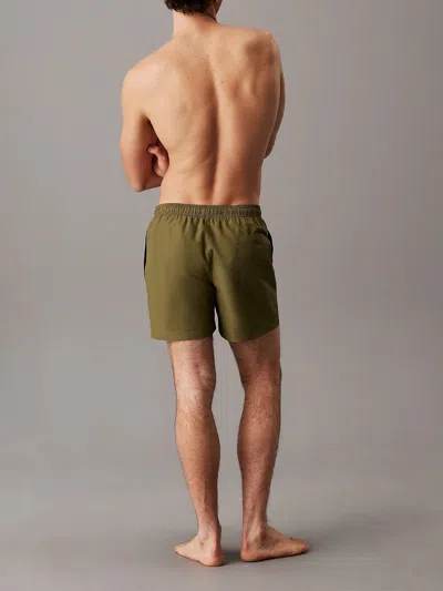 Calvin Klein Medium Drawstring Swim Shorts Featuring Pockets In Green