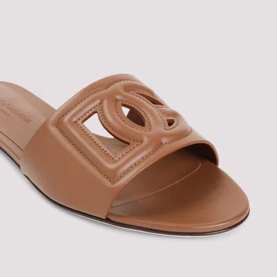 Dolce & Gabbana Slide Sandals With Cut Out Logo In Leather Woman In Brown