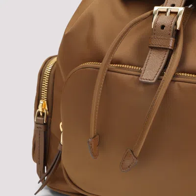 Prada Triangle Logo Nylon Backpack In Brown