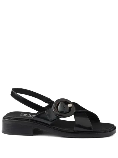 Prada Brushed Leather Crisscross Band Sandals With Plexiglas Buckle In Black