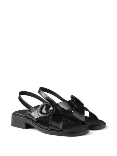 Prada Brushed Leather Crisscross Band Sandals With Plexiglas Buckle In Black