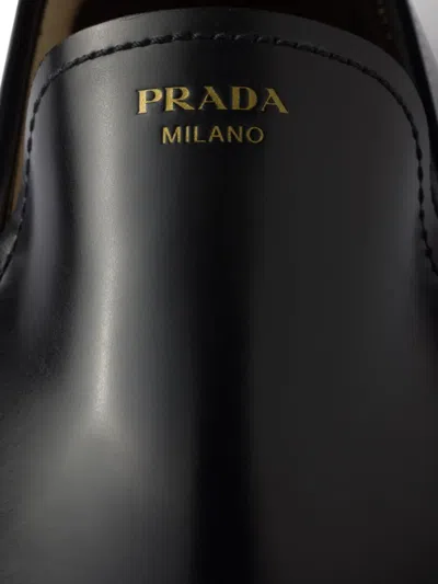 Prada Brushed Fumé Leather Loafers In Black