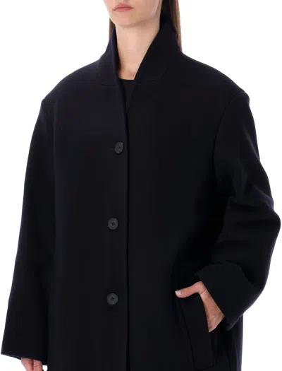 Studio Nicholson Long Coat With Structured Shoulders And Pockets In Black