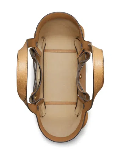 Tory Burch Jacquemus Ovalo Clutch In Tiramisu