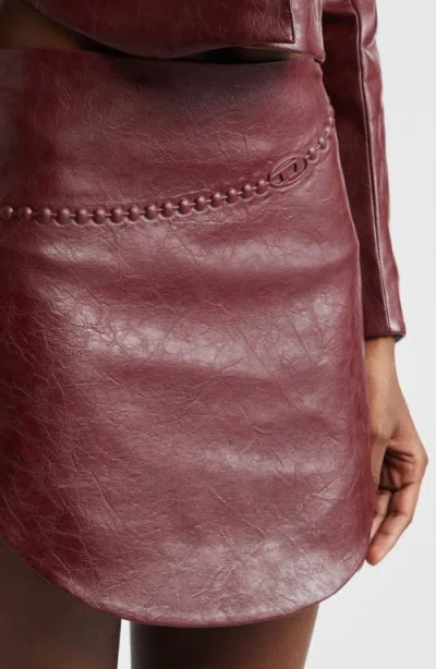 Diesel Coated Miniskirt With Embossed Motif In Burgundy