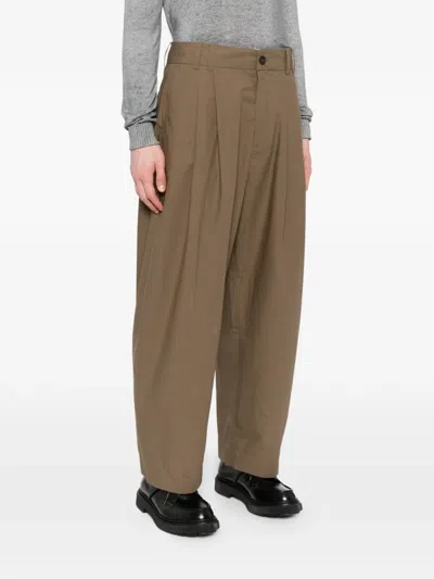Studio Nicholson Pleated Yale Trousers In Brown