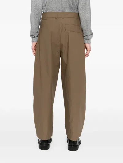 Studio Nicholson Pleated Yale Trousers In Brown