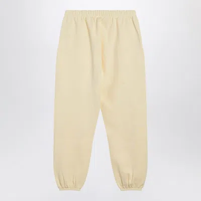 Essentials Logo Patch Track Pants In Yellow