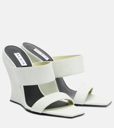 Alaïa 110 Suede Wedge Mules In White