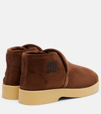 Miu Miu Logo Shearling-lined Suede Ankle Boots In Brown