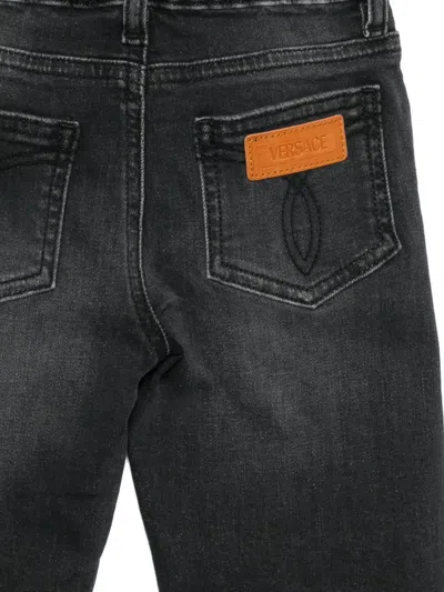 Versace Logo-patched Jeans In Black