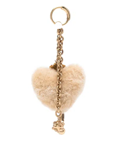 Chloé Two-tone Shearling And Metal Charm In Gold