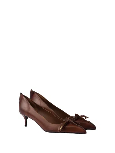 Prada Pumps In Antiqued Leather With Exposed Stitching And Raw Edges In Brown